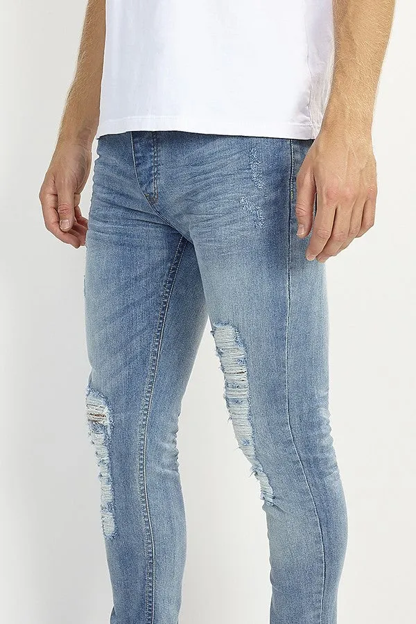 RIPPED LEG DISTRESSED BLUE SKINNY JEANS