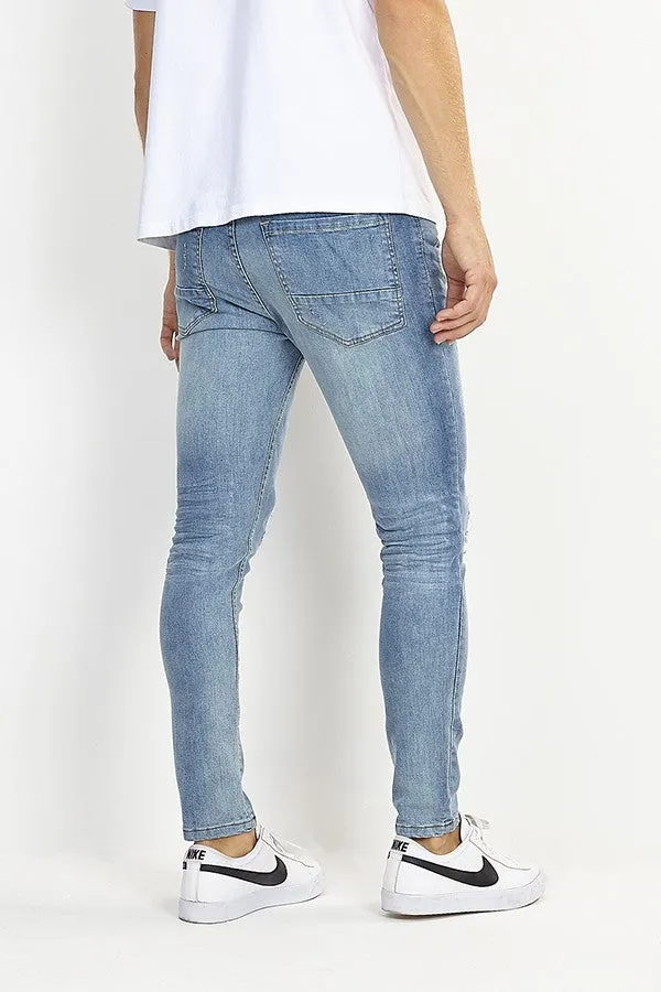 RIPPED LEG DISTRESSED BLUE SKINNY JEANS
